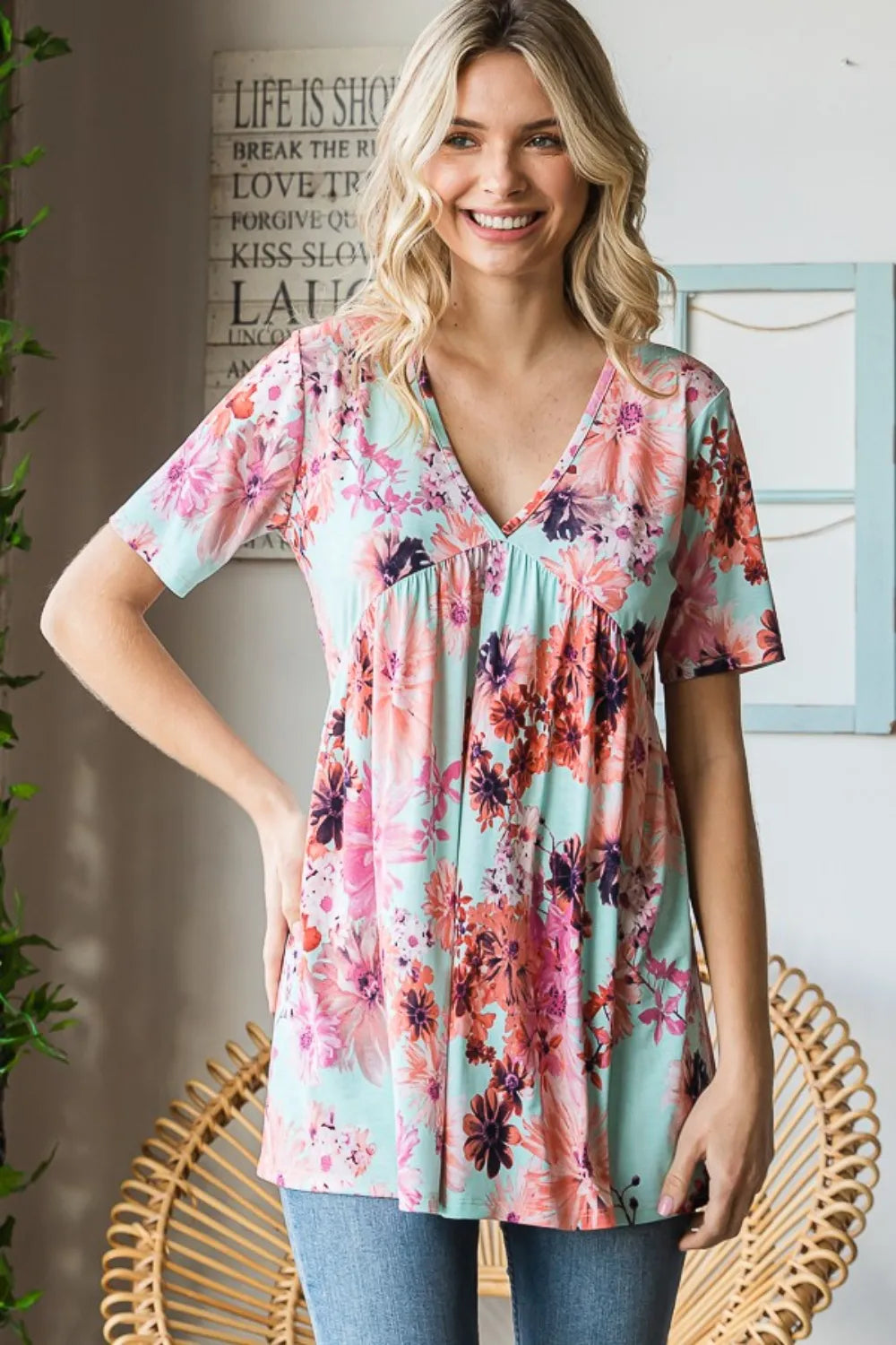 Heimish floral v-neck short sleeve babydoll blouse with a relaxed fit, featuring a feminine floral pattern and lightweight fabric.