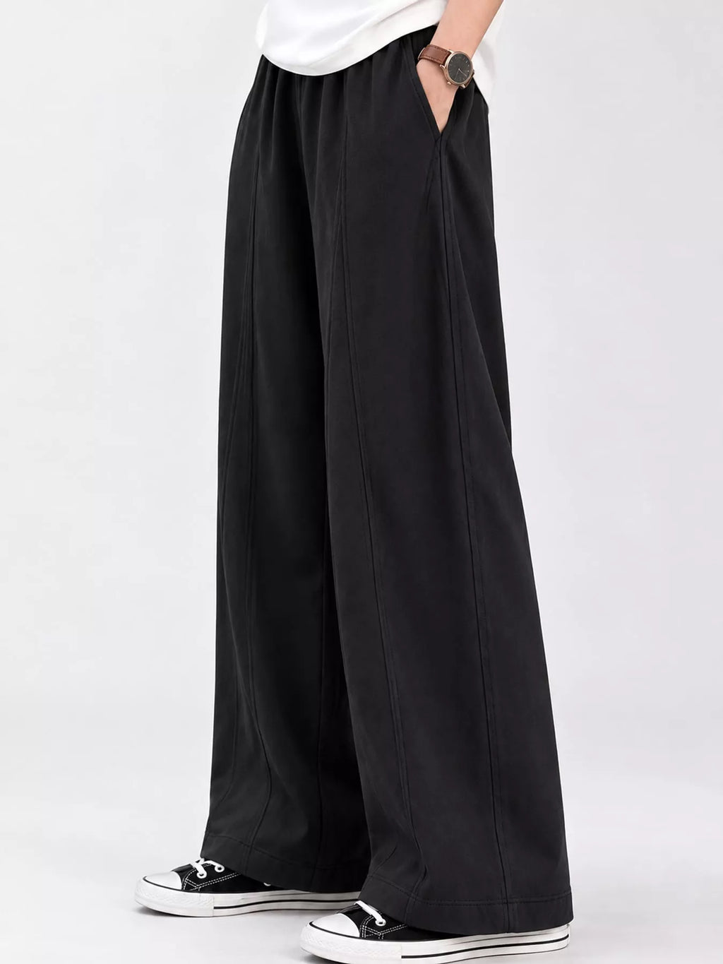 Wide-leg casual pants from Trendsi with a relaxed fit, featuring a high waist and flowing fabric for a comfortable, stylish look.