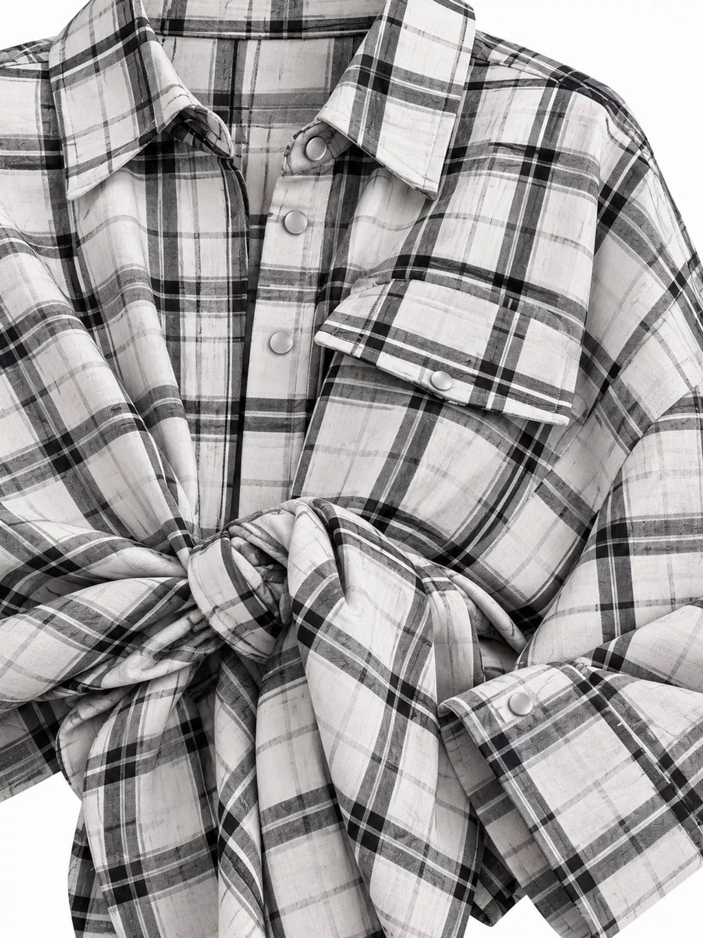 Plaid button-up shirt by Trendsi featuring a classic pattern, long sleeves, and a collared front, displayed on a hanger.