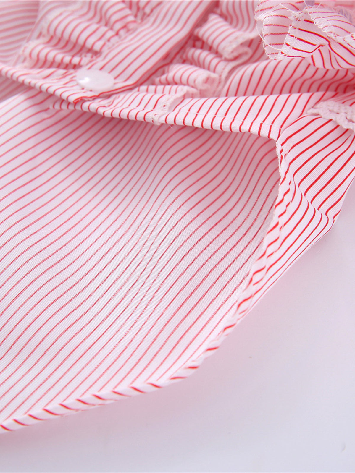 Striped ruffle pet top with bow from Trendsi, featuring a cute, colorful design perfect for small dogs or cats.