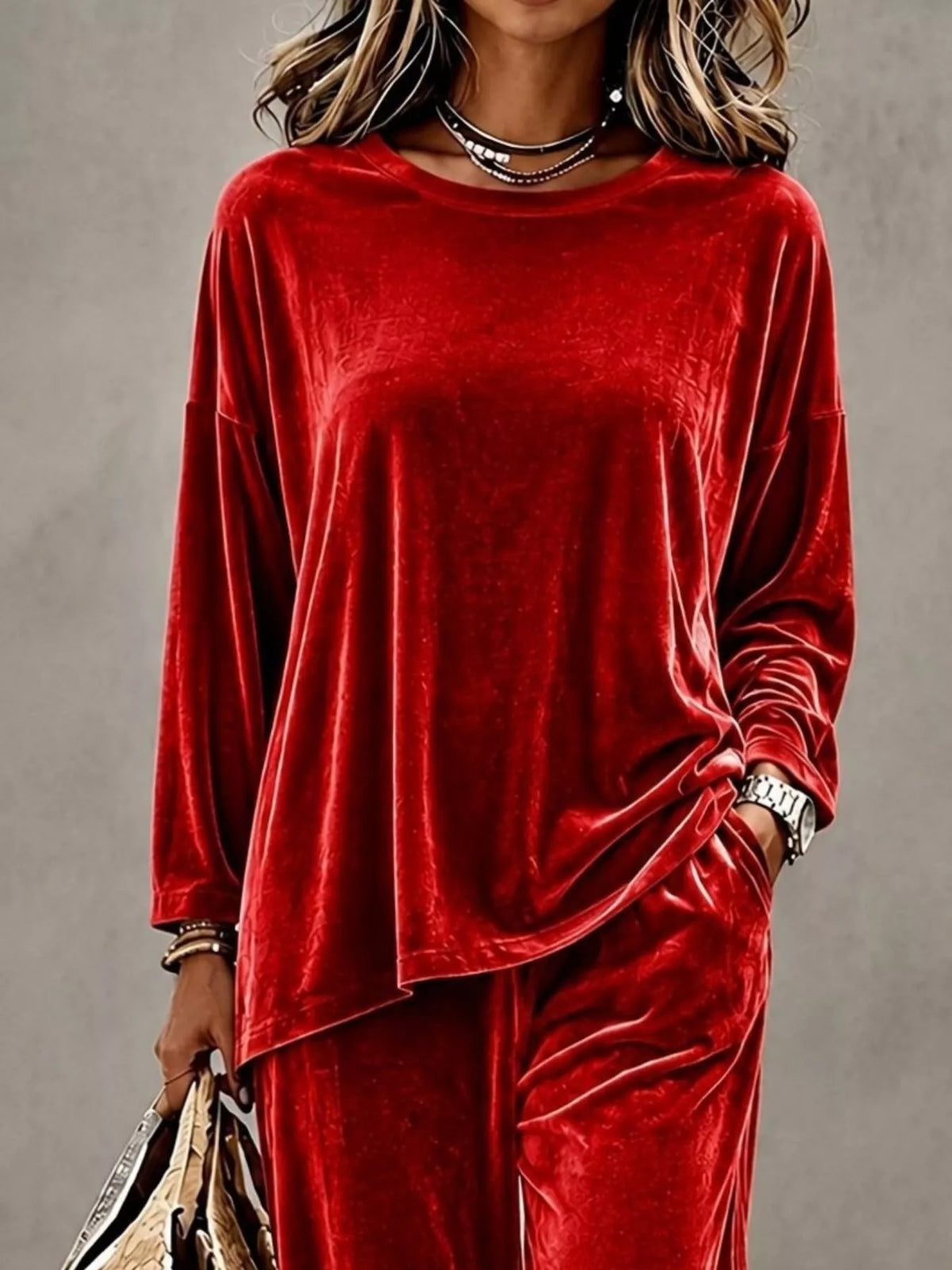 Plus size velvet long sleeve top and pants set by Trendsi, featuring a stylish, full-length matching outfit with a soft, luxurious fabric.