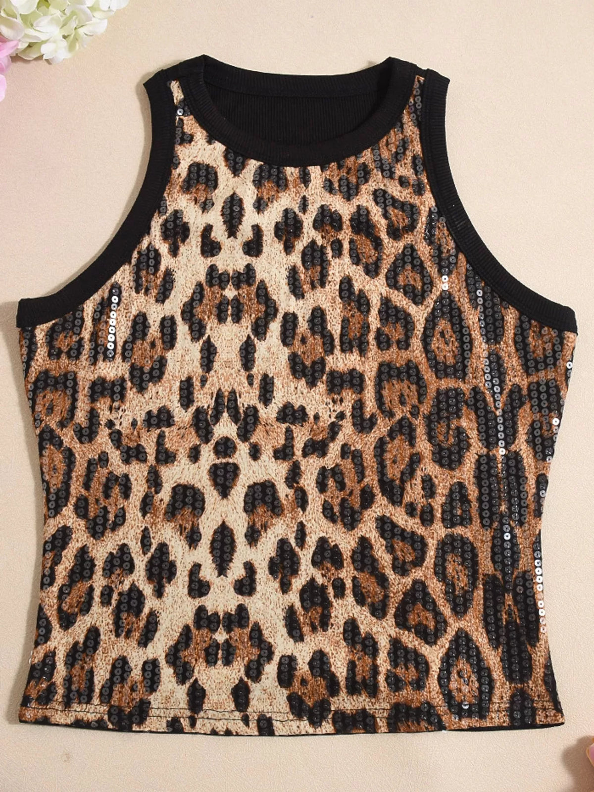 Sequin round neck tank top by Trendsi featuring shiny sequins and a classic sleeveless design.