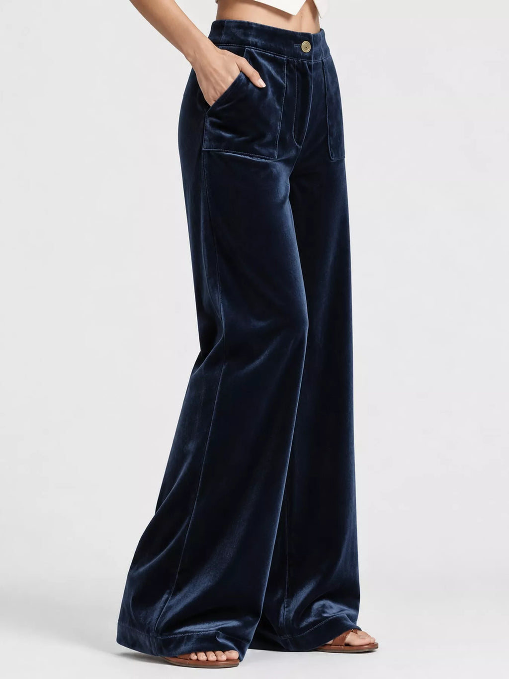 Plus size high-waisted wide-leg velvet pants with pockets from Trendsi, featuring a luxurious texture and relaxed fit.