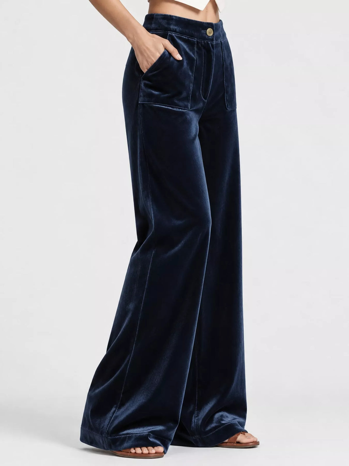 Plus size high-waisted wide-leg velvet pants with pockets from Trendsi, featuring a luxurious texture and relaxed fit.