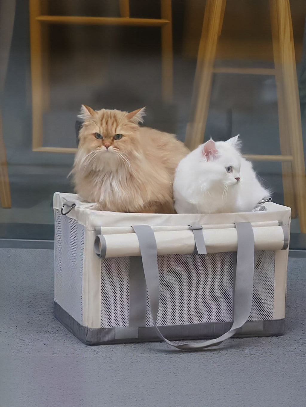Portable breathable pet carrier bag by Trendsi, featuring mesh sides for airflow and comfortable carrying for small pets.