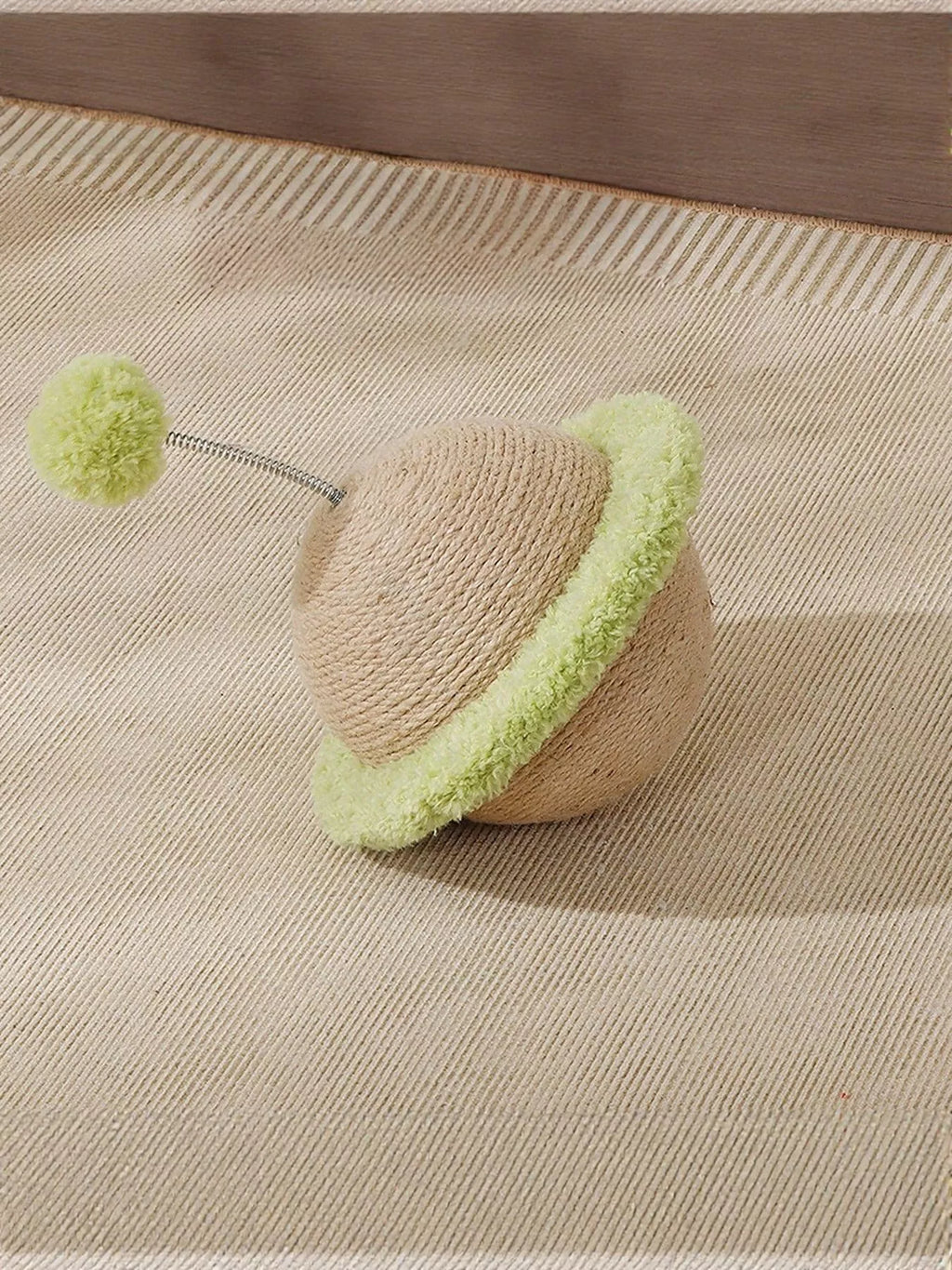 Planet-shaped interactive cat toy with sisal scratching surface, colorful and engaging for cats to play and scratch.