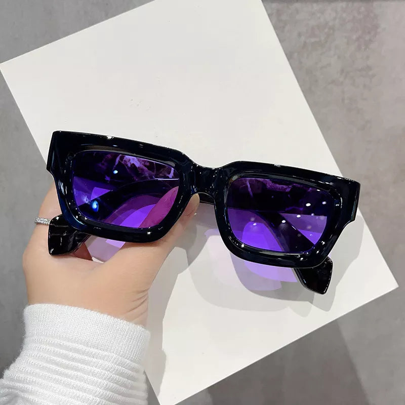 Vintage rectangular sunglasses by Trendsi with dark tinted lenses and a sleek black frame, stylish and suitable for everyday wear.
