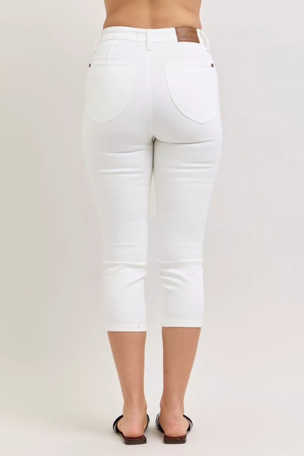 Judy Blue high waist capri pants with extended waistband and spade pockets, stylish and comfortable women's denim bottoms.