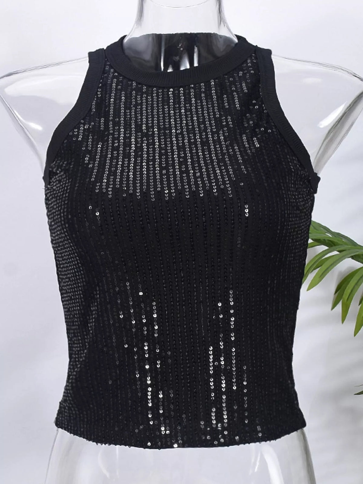 Sequin round neck tank top by Trendsi featuring shiny sequins and a classic round neckline, sleeveless design, and stylish fit.