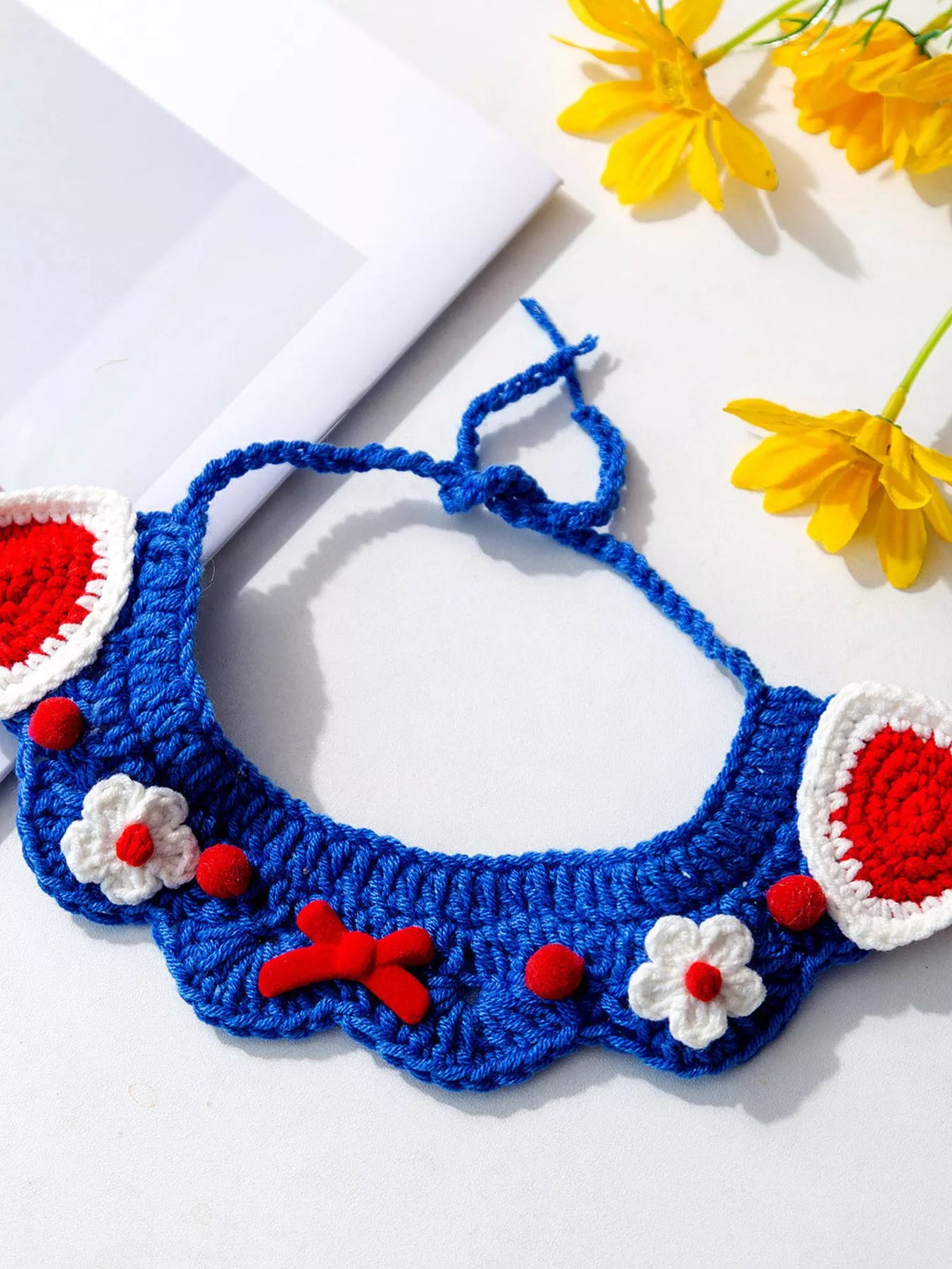 Handmade crochet floral pet scarf with colorful flower patterns, perfect for small dogs or cats, by Trendsi.