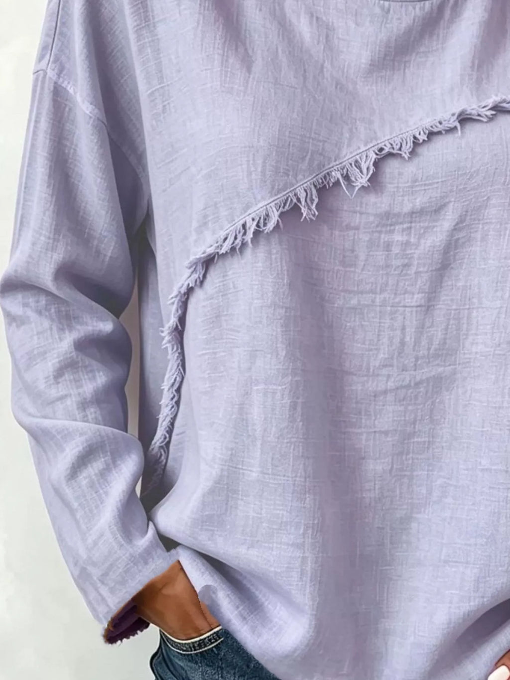 Frayed hem dropped shoulder blouse by Trendsi, featuring a relaxed fit with distressed frayed details on the hem and shoulder.