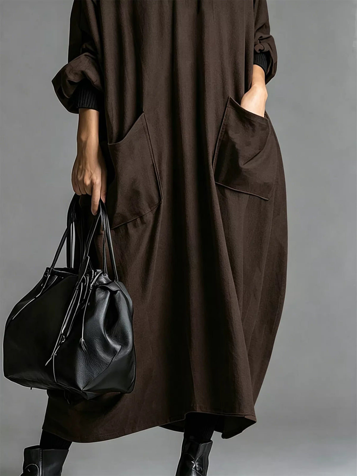 Plus size loose-fit mock neck midi dress with pockets by Trendsi, featuring a full-length, comfortable, stylish design.