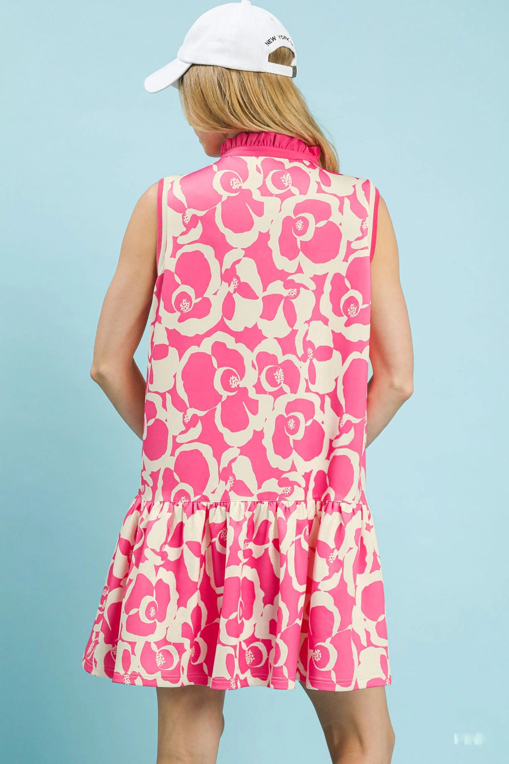 Umgee floral sleeveless tiered dress featuring a flowy design and vibrant floral pattern, perfect for warm weather wear.