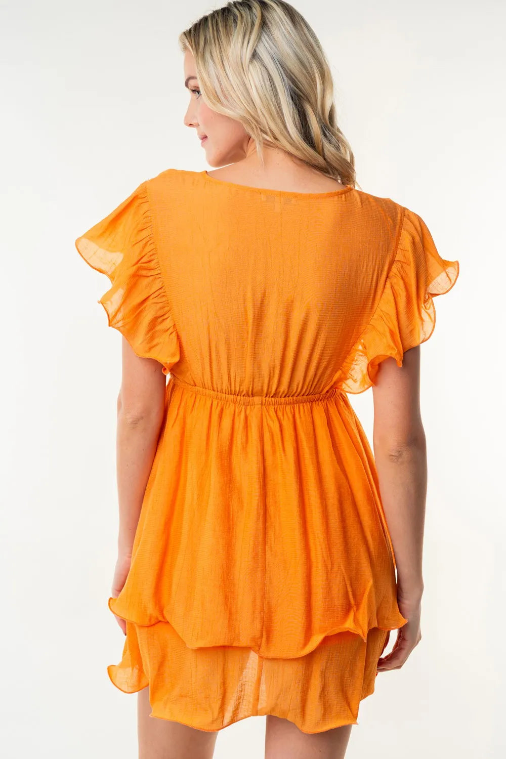 White Birch full size short sleeve woven layered dress by Trendsi, displayed on a hanger with visible fabric textures.
