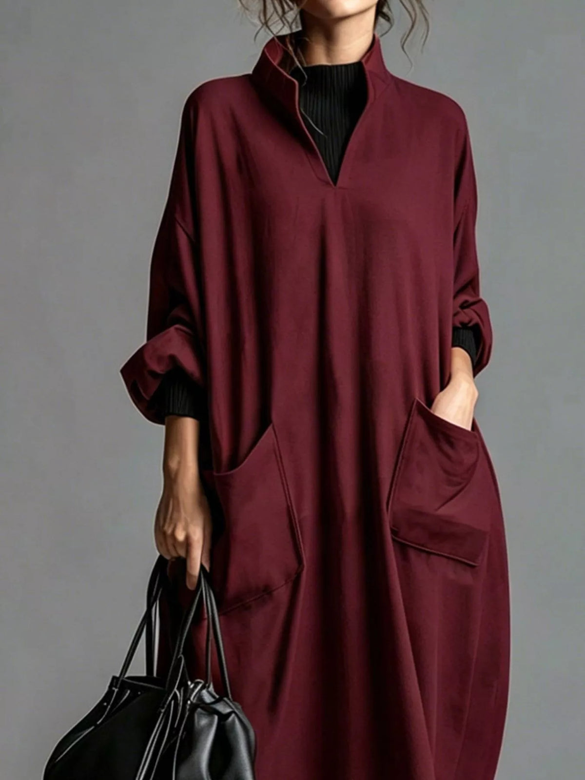 Plus size loose-fit mock neck midi dress with pockets from Trendsi, featuring a comfortable, full-size design and casual style.