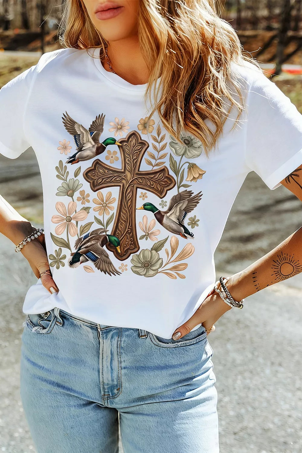Plus size mallard cross floral graphic casual T-shirt by Trendsi, featuring a full-size bird and floral design on soft fabric.