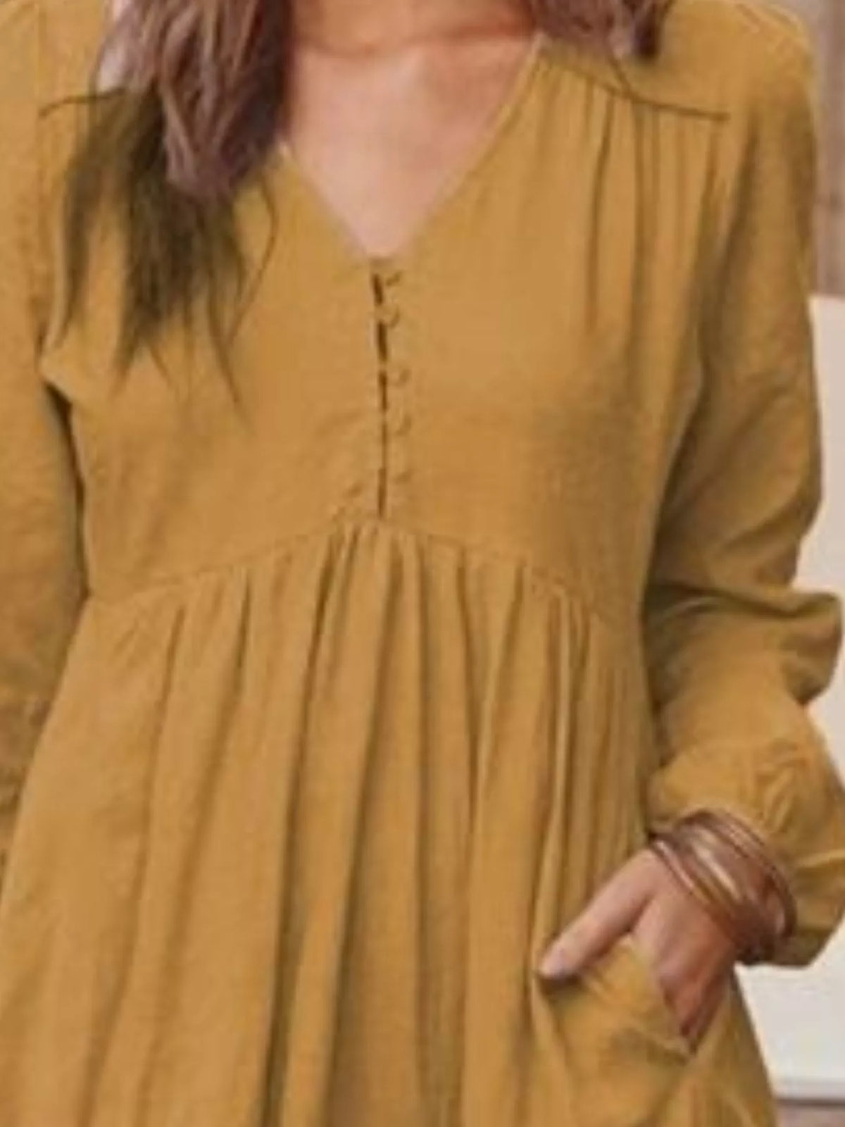 Plus size full-length V-neck long sleeve tiered maxi dress with pockets by Trendsi, featuring a flowy silhouette and comfortable fit.