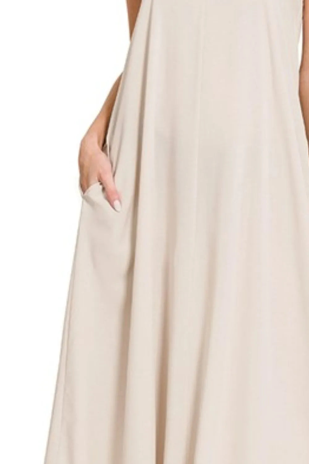 Zenana woven arc hem cami dress with flowy pockets, featuring a stylish design and comfortable fit, shown in the product image.