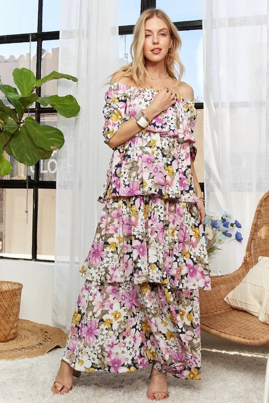 Trendsi ADORA layered floral off-shoulder short sleeve maxi dress in mauve, featuring a flowing design and floral pattern.