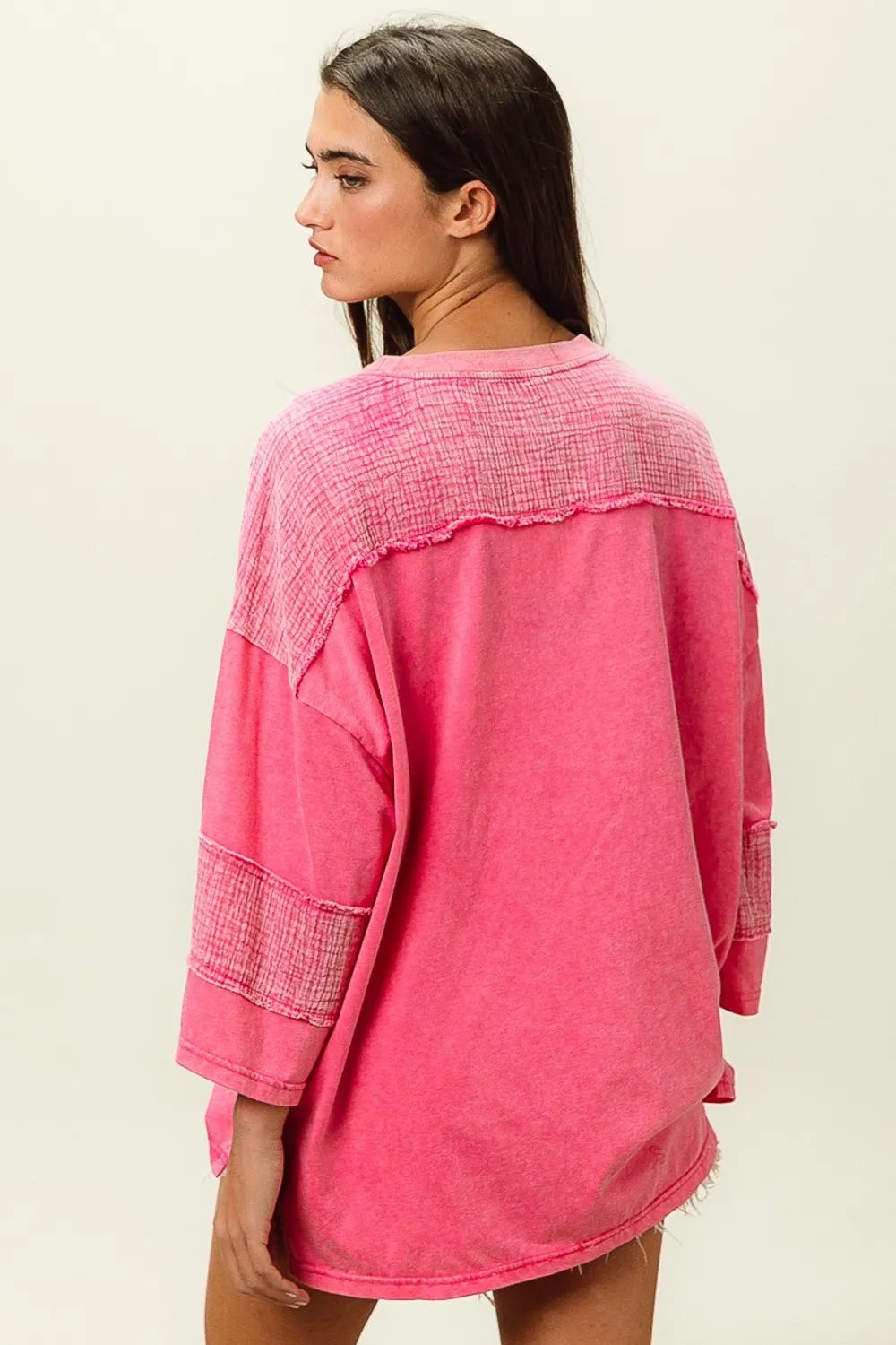 BiBi high-low washed T-shirt by Trendsi, featuring a casual fit and distressed wash, displayed on a hanger.