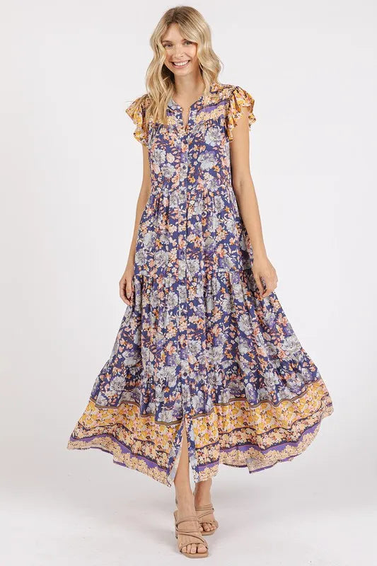 Floral ruffled notched cap sleeve maxi dress by Trendsi, featuring a flowing design with a ruffled collar and floral pattern.