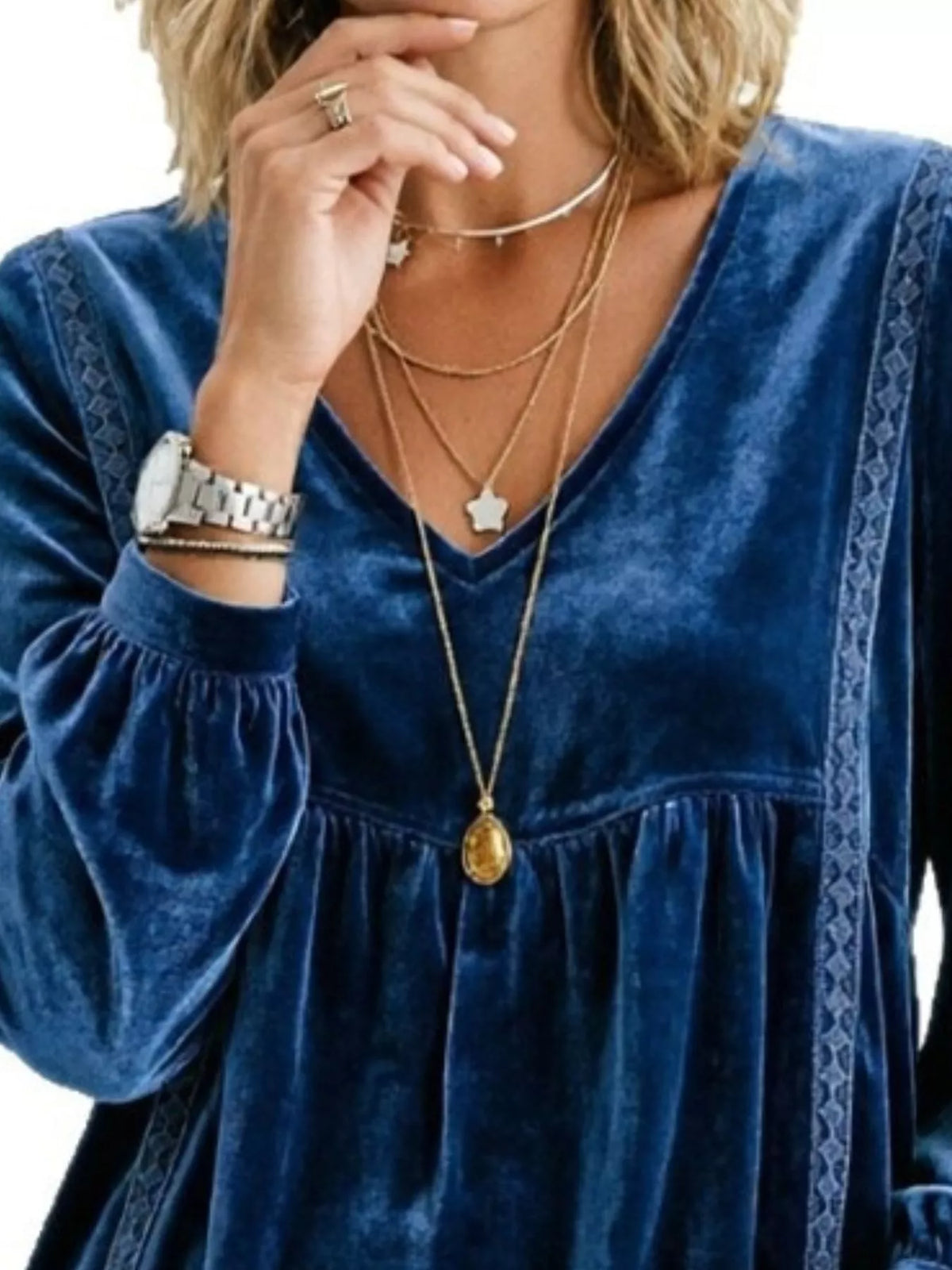 Plus size velvet blouse with v-neck, long sleeves, and lace trim, featuring a full size fit from Trendsi.