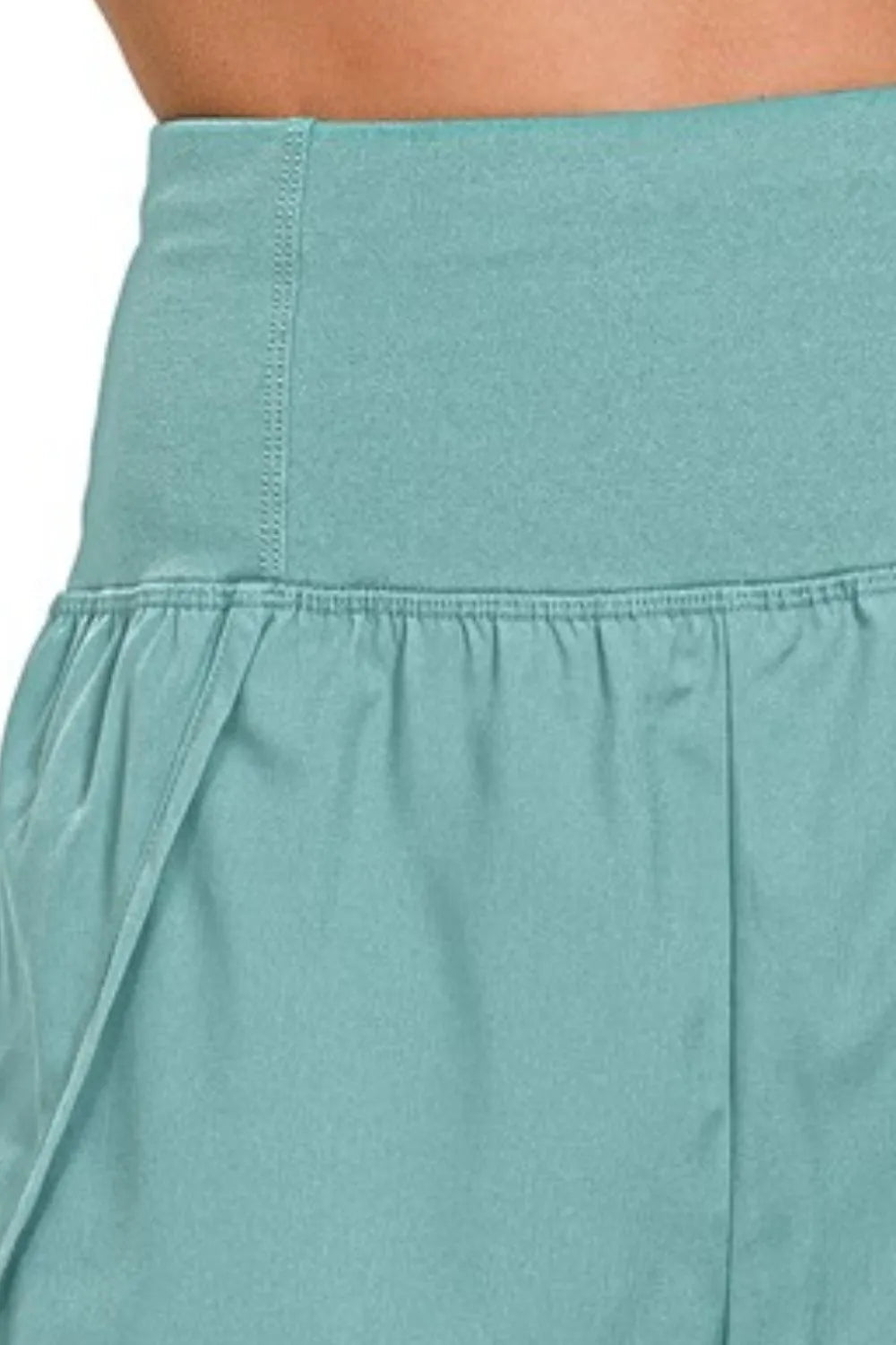 Zenana high-waisted zippered back pocket running shorts in black, featuring a comfortable fit and athletic design.