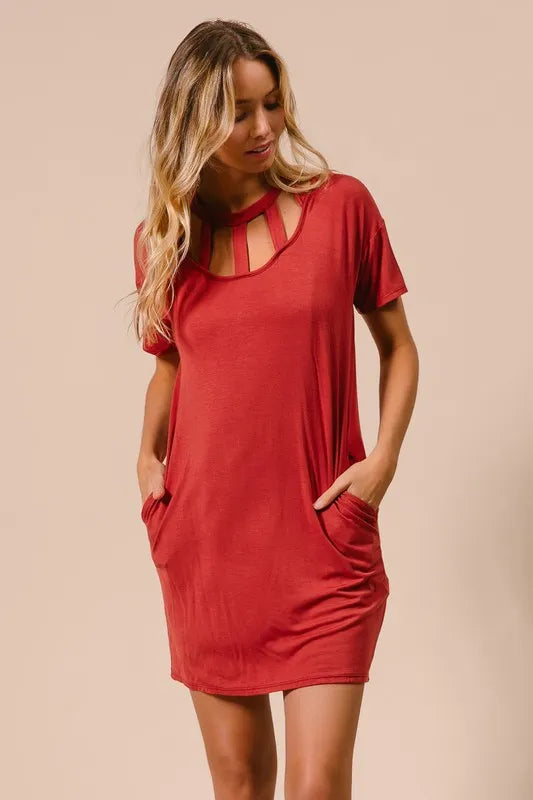 Trendsi BiBi front cutout mini tee dress with pockets, casual black dress featuring a fitted silhouette and short sleeves.