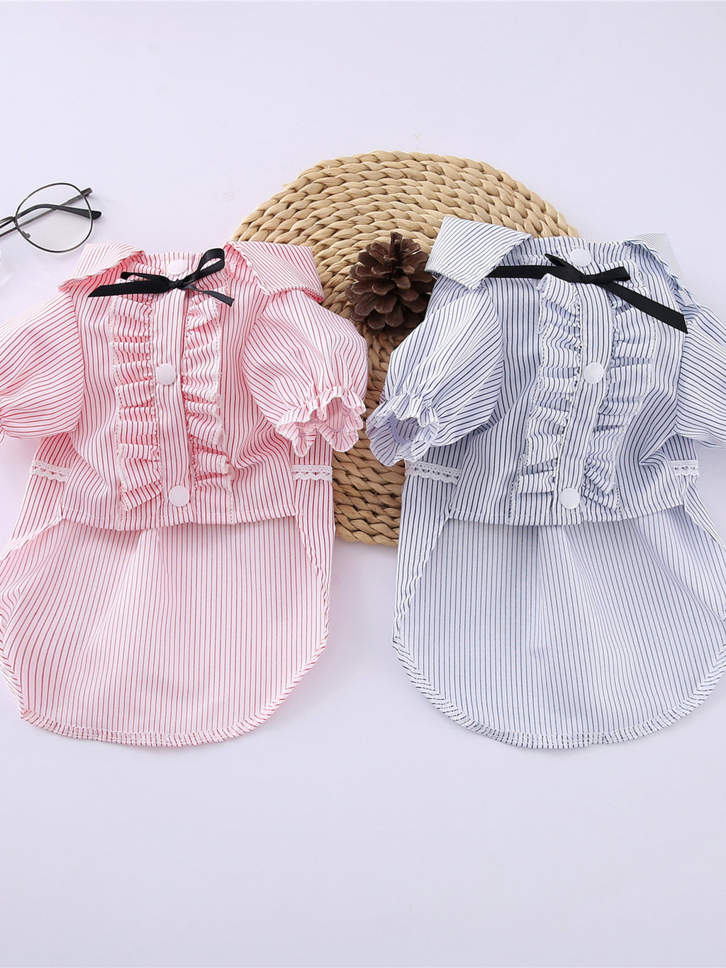Striped ruffle pet top with bow from Trendsi, featuring colorful stripes and a cute bow detail on a small dog.