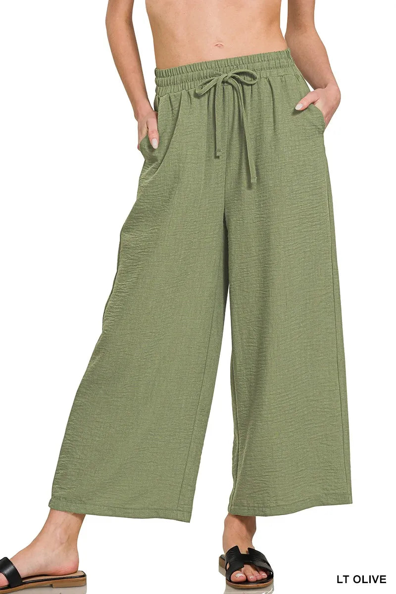 Woven crepe crop pants with elastic waistband from Zenana, featuring a relaxed fit and versatile style in neutral fabric.
