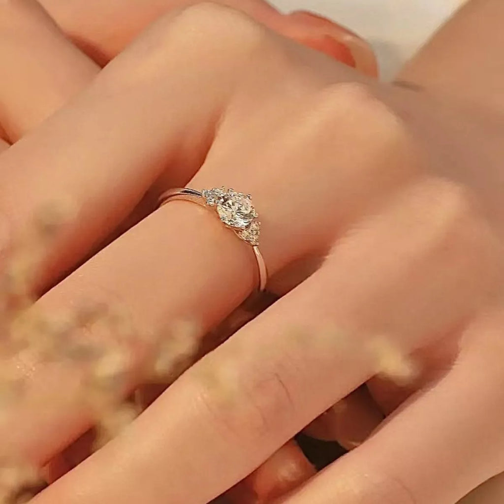 Sterling silver ring with 1 carat moissanite gemstone, elegant jewelry piece with a sparkling center stone.