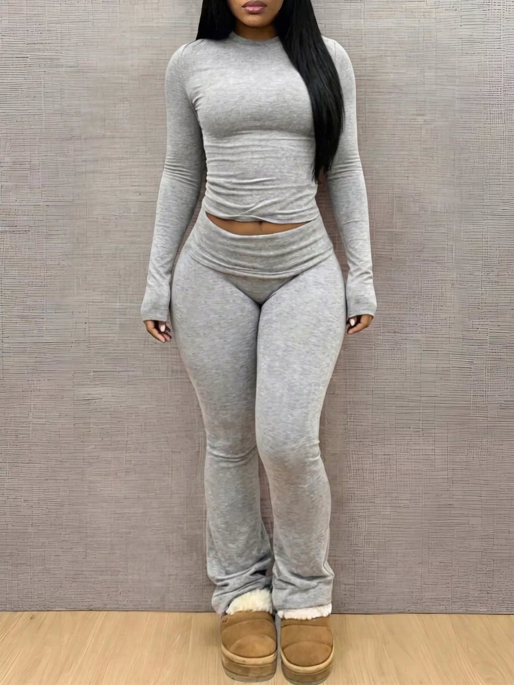Slim-fit long sleeve crop top and matching leggings lounge set by Trendsi, stylish and comfortable for casual wear.