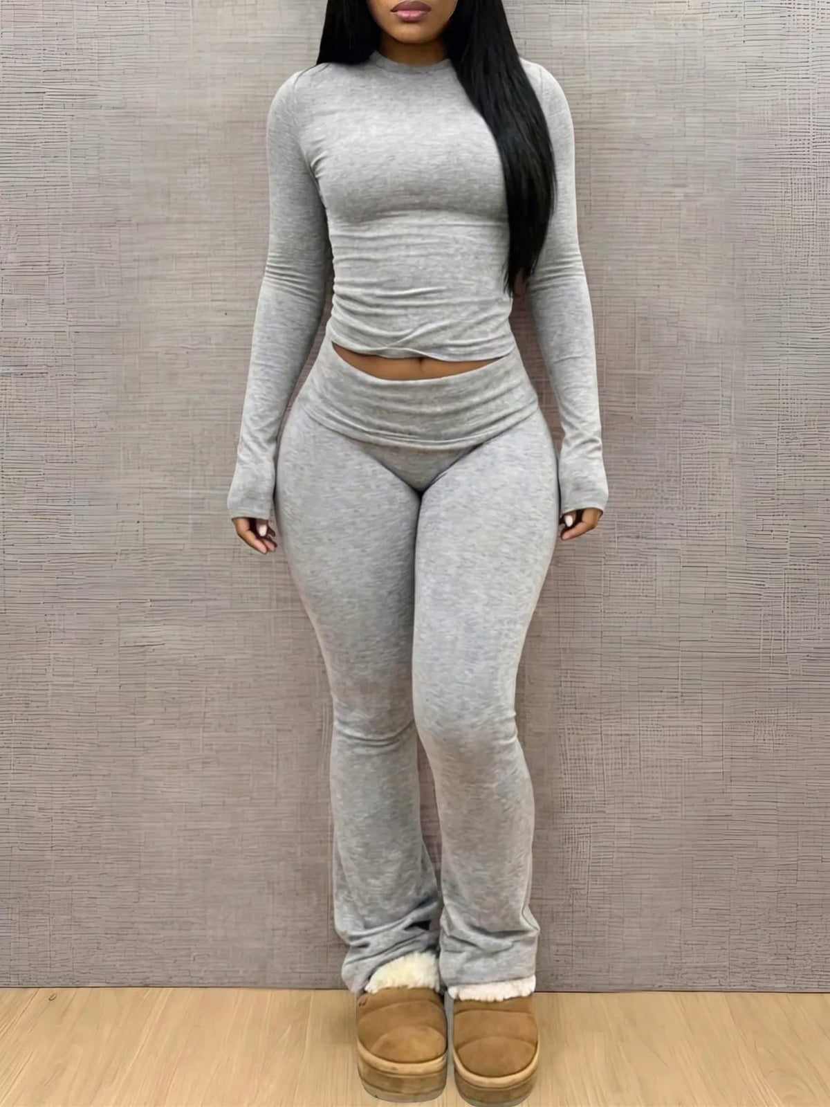 Slim-fit long sleeve crop top and matching leggings lounge set by Trendsi, stylish and comfortable for casual wear.