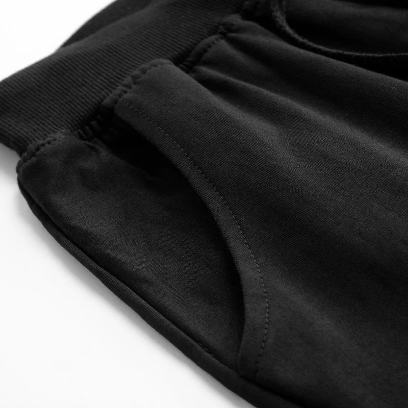 Pantalones cortos deportivos de hombre con cordón hasta la rodilla