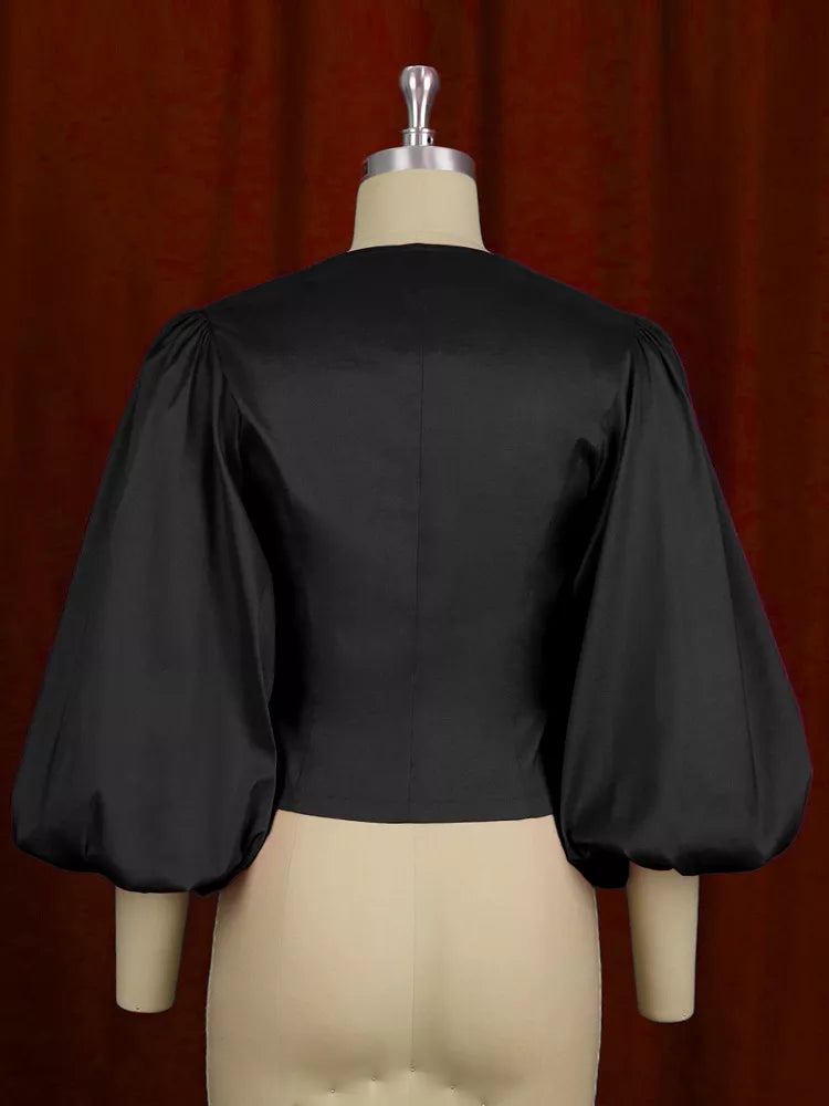 Plus size double-breasted puff sleeve blouse by Trendsi, featuring full size fit and stylish design, shown in the image.