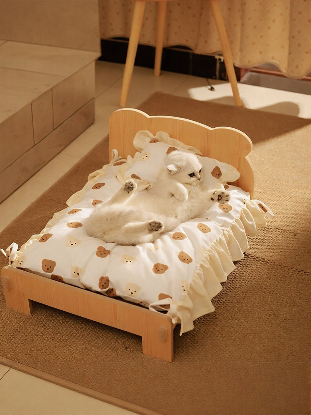 Wooden pet bed with a cozy cushion, featuring a natural wood frame, designed for small to medium-sized dogs or cats.