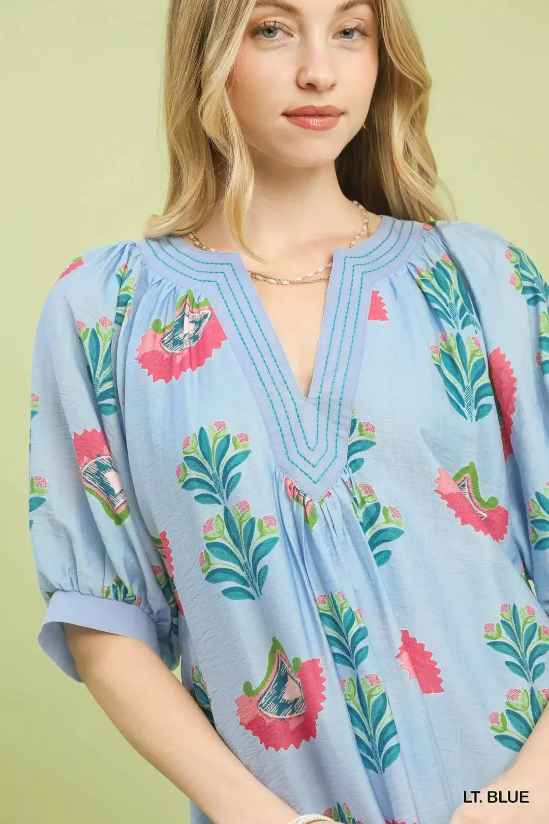 Umgee abstract print mini dress featuring a flowy silhouette and vibrant pattern, perfect for casual or summer wear.