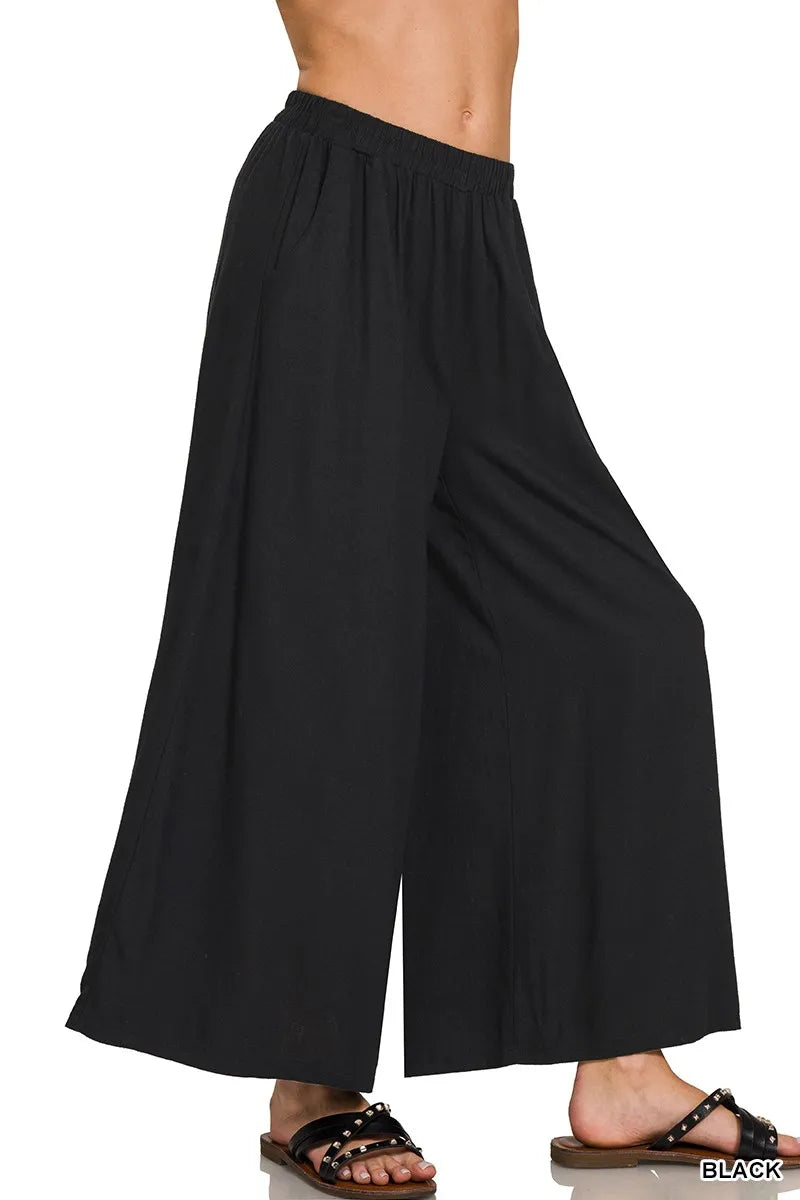 Light beige Zenana woven pleated linen blend wide-leg pants with a relaxed fit and waistband, displayed on a neutral background.