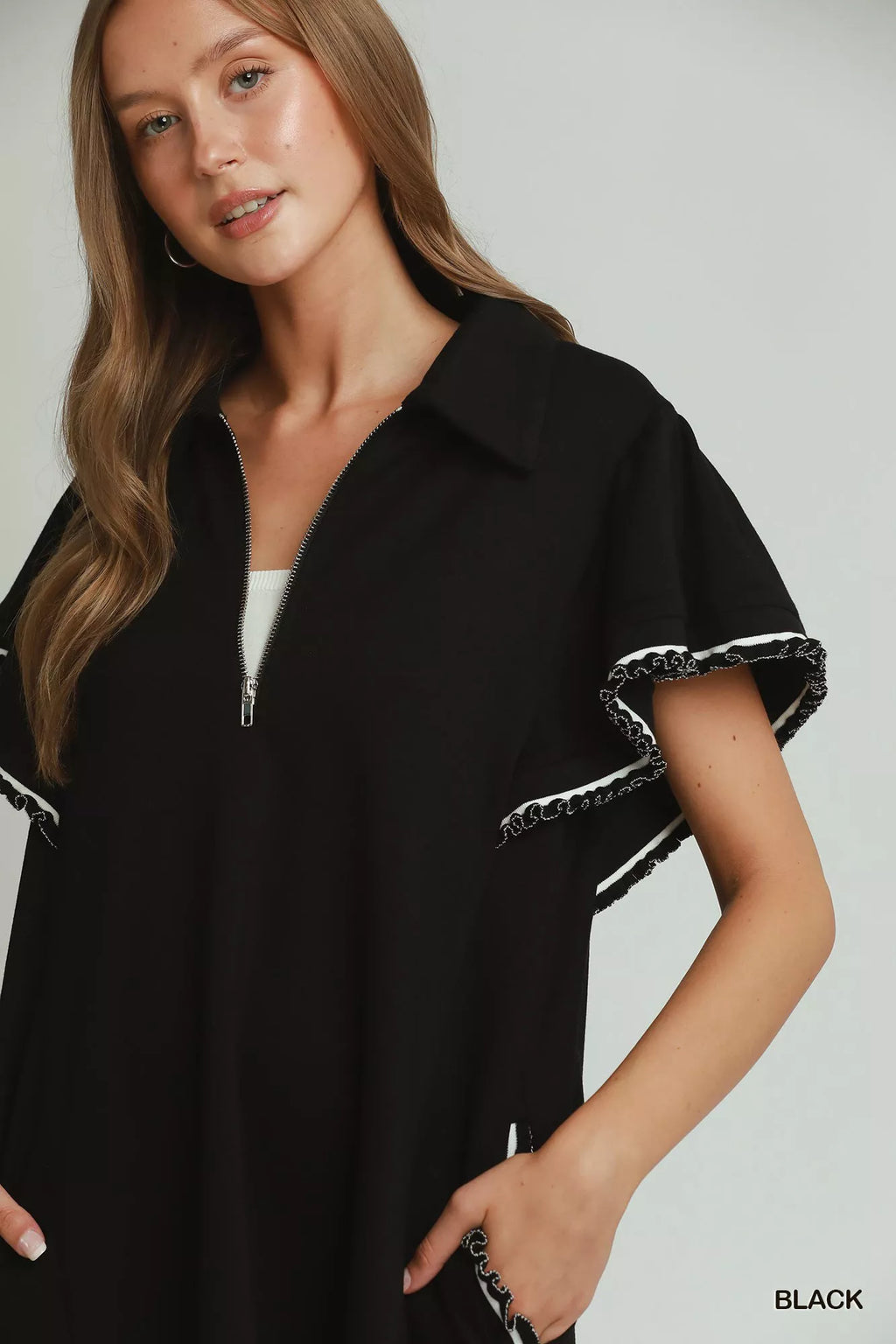 Umgee buttercup yellow mini dress with ruffle rib band, half zip, butterfly sleeves, and pockets, styled by Trendsi.