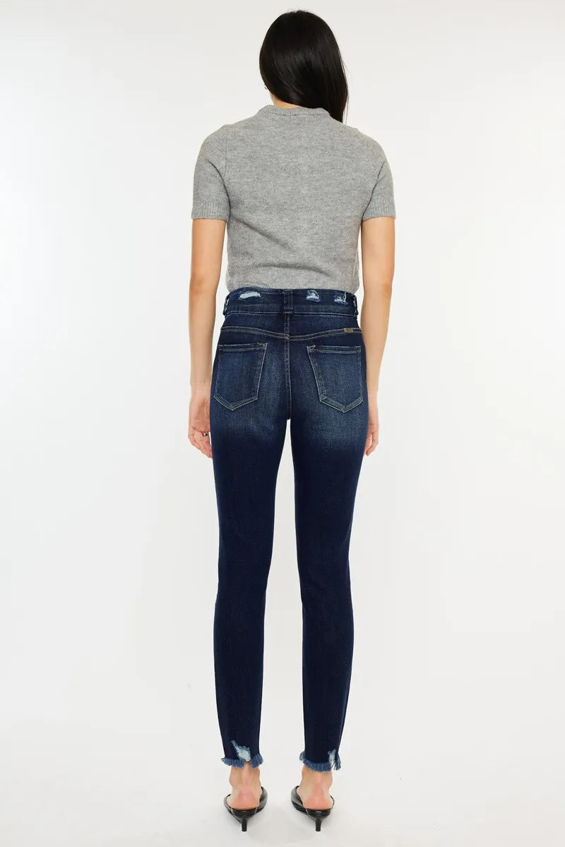 Kancan high waist jeans with raw hem and cat's whiskers design by Trendsi, showcasing the denim's distressed details and fit.