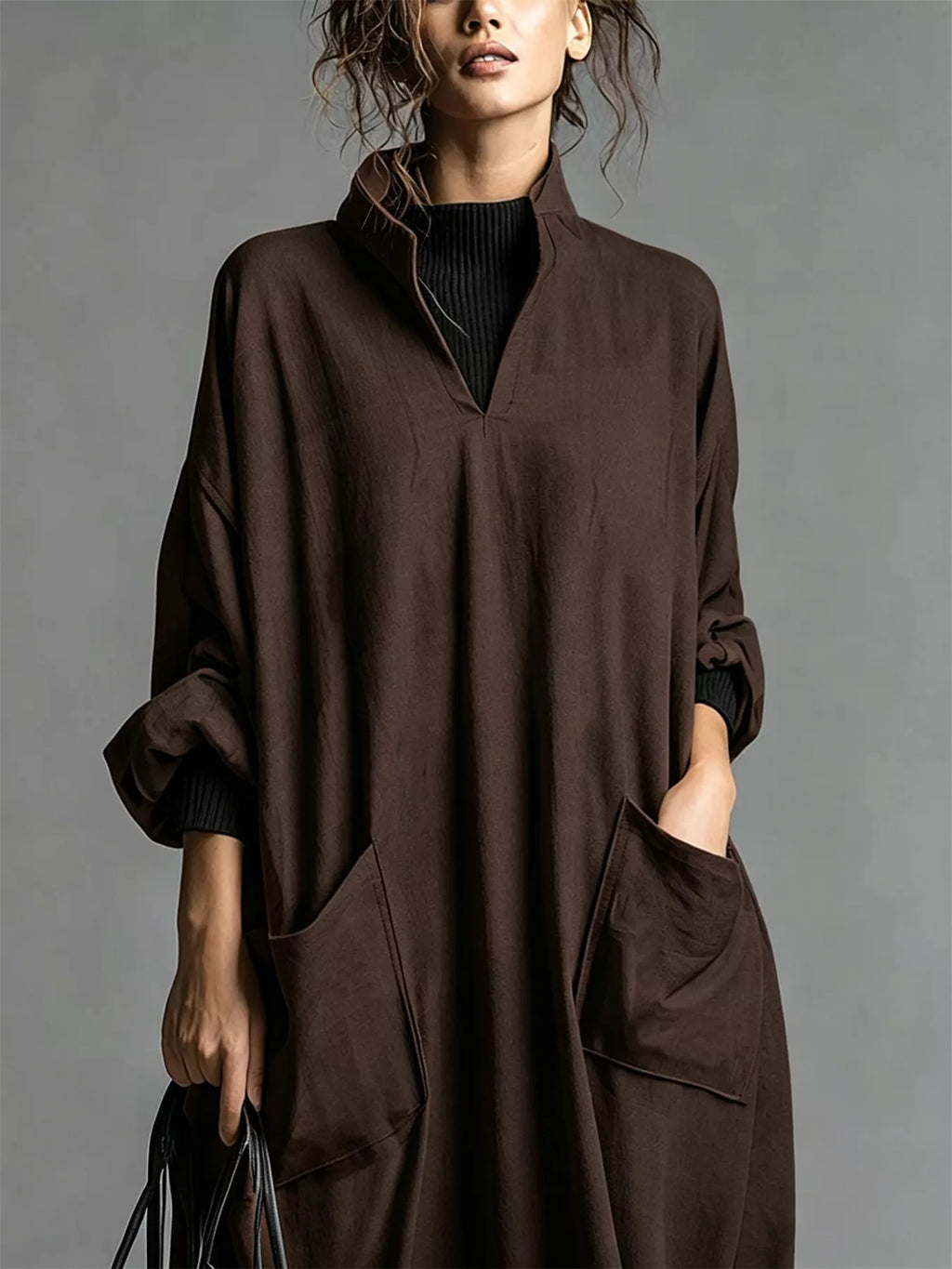 Plus size full-length loose-fit mock neck midi dress with pockets by Trendsi, shown in a natural pose.