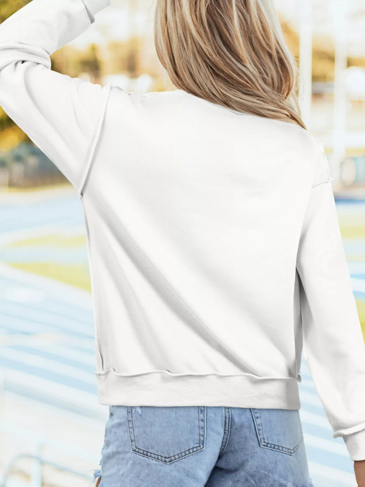 White mock neck sweatshirt with floral cross print, view 2