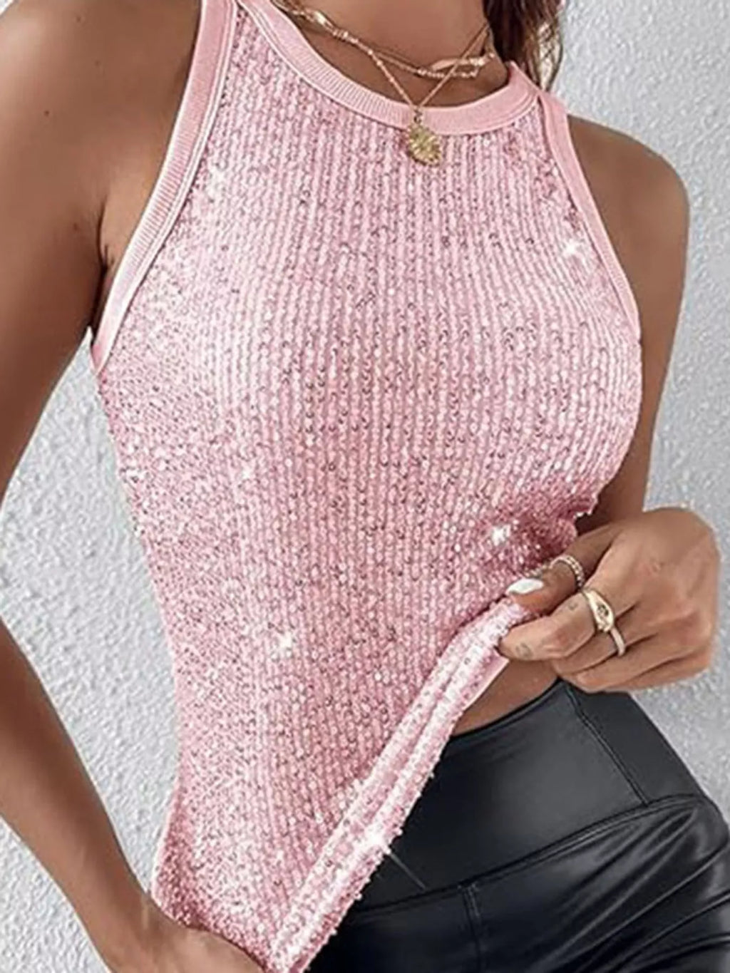 Sequin round neck tank top from Trendsi featuring shiny sequins and a classic sleeveless design, ideal for stylish casual wear.