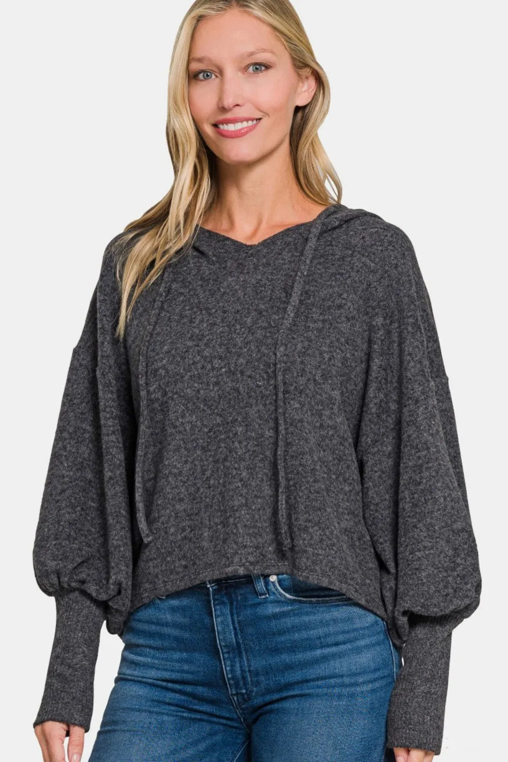 Brushed hacci drop shoulder cropped hoodie by Trendsi, featuring cozy fabric and relaxed fit, shown on a model.