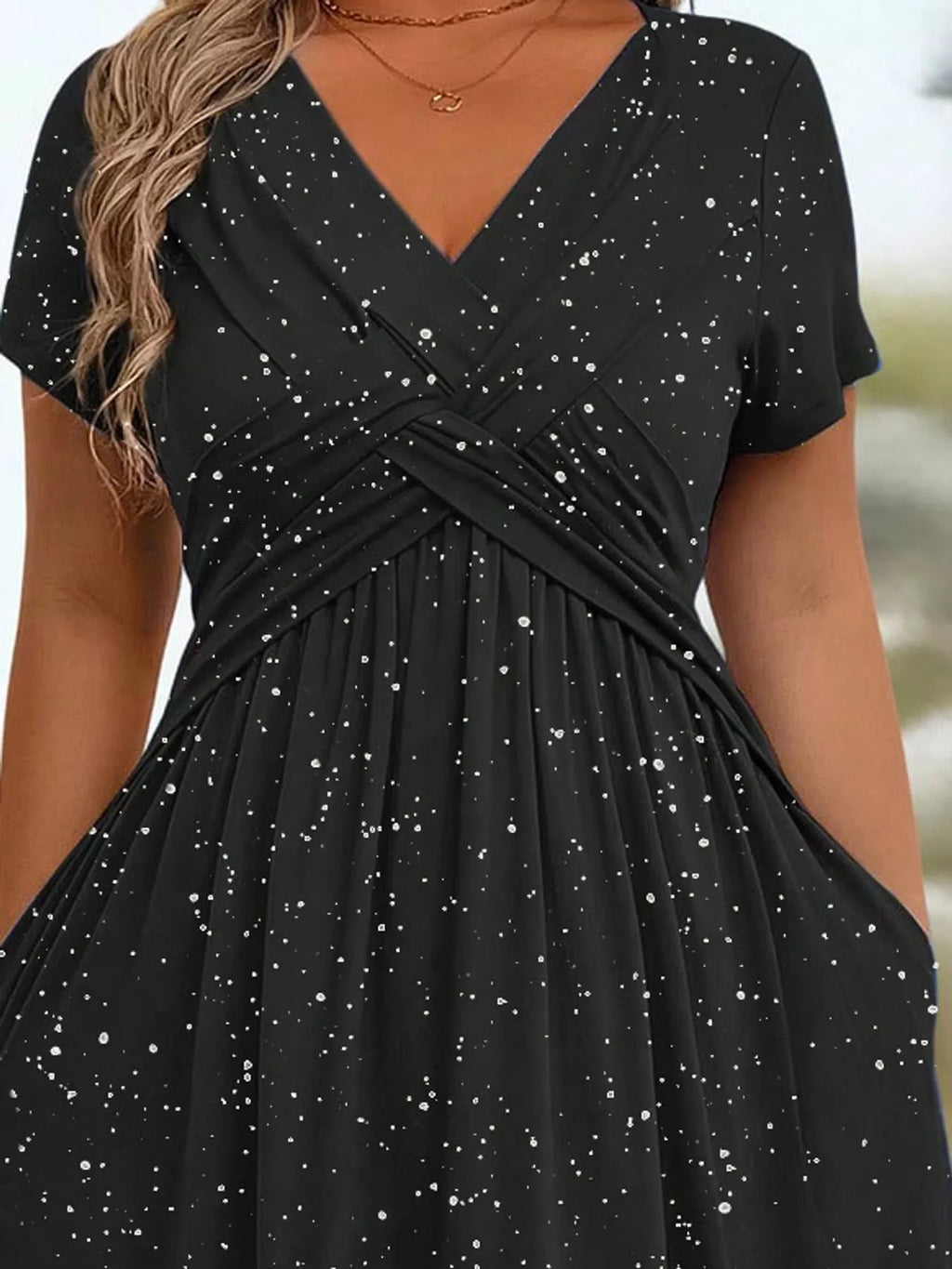 Plus size twisted front short sleeve midi dress with pockets by Trendsi, featuring a full-length design and stylish front twist detail.