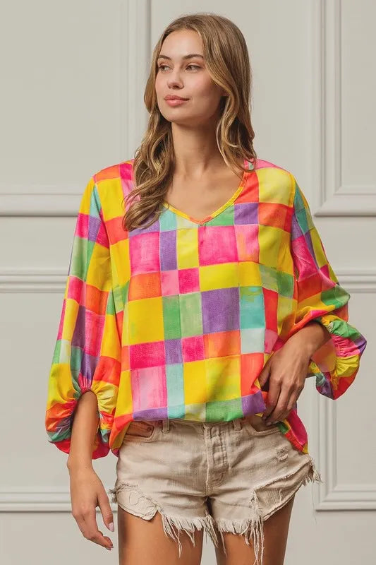 Colorful BiBi Multi Block Bubble Pop Balloon top by Trendsi with vibrant, playful design and bubble motifs on a white background.