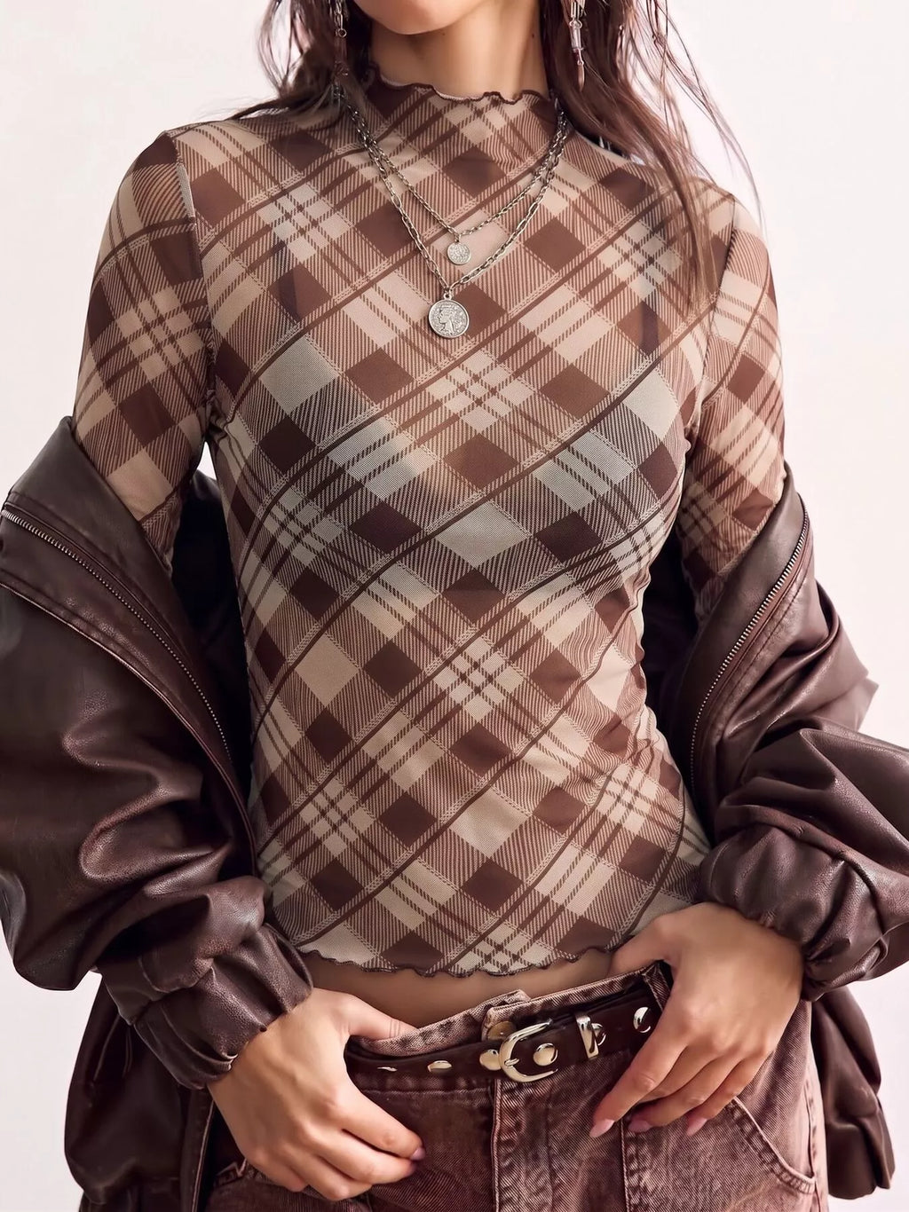 Sheer mesh plaid mock neck long sleeve T-shirt by Trendsi, featuring a fitted design with see-through fabric and stylish pattern.