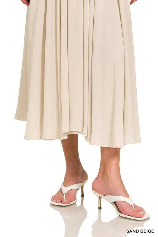 Woven crinkle gauze crop tee and skirt set by Trendsi, featuring lightweight, textured fabric in a coordinated style.