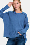 Full size Zenana brushed round neck sweater with exposed seams, showcasing a cozy, casual fit in soft fabric.