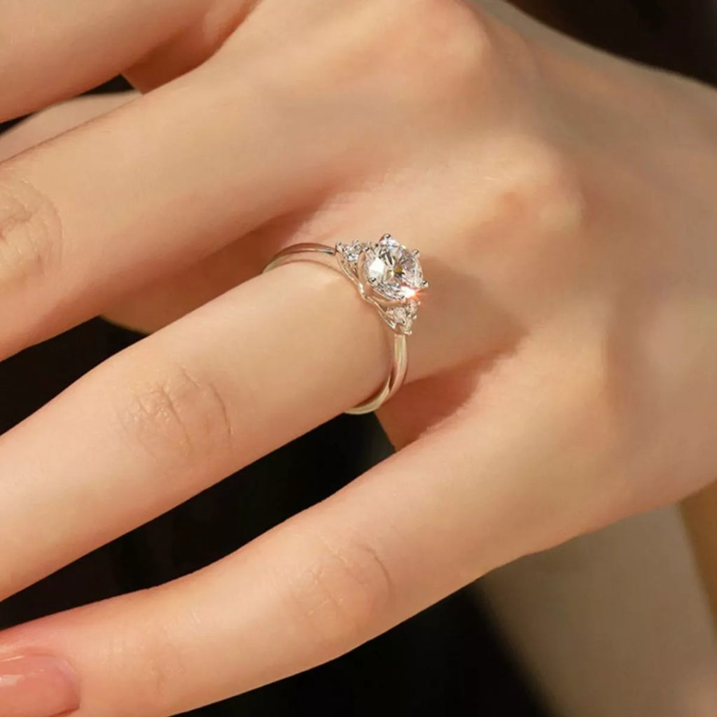 Sterling silver ring featuring a 1-carat moissanite gemstone, designed by Trendsi, showcasing a sparkling, elegant jewelry piece.